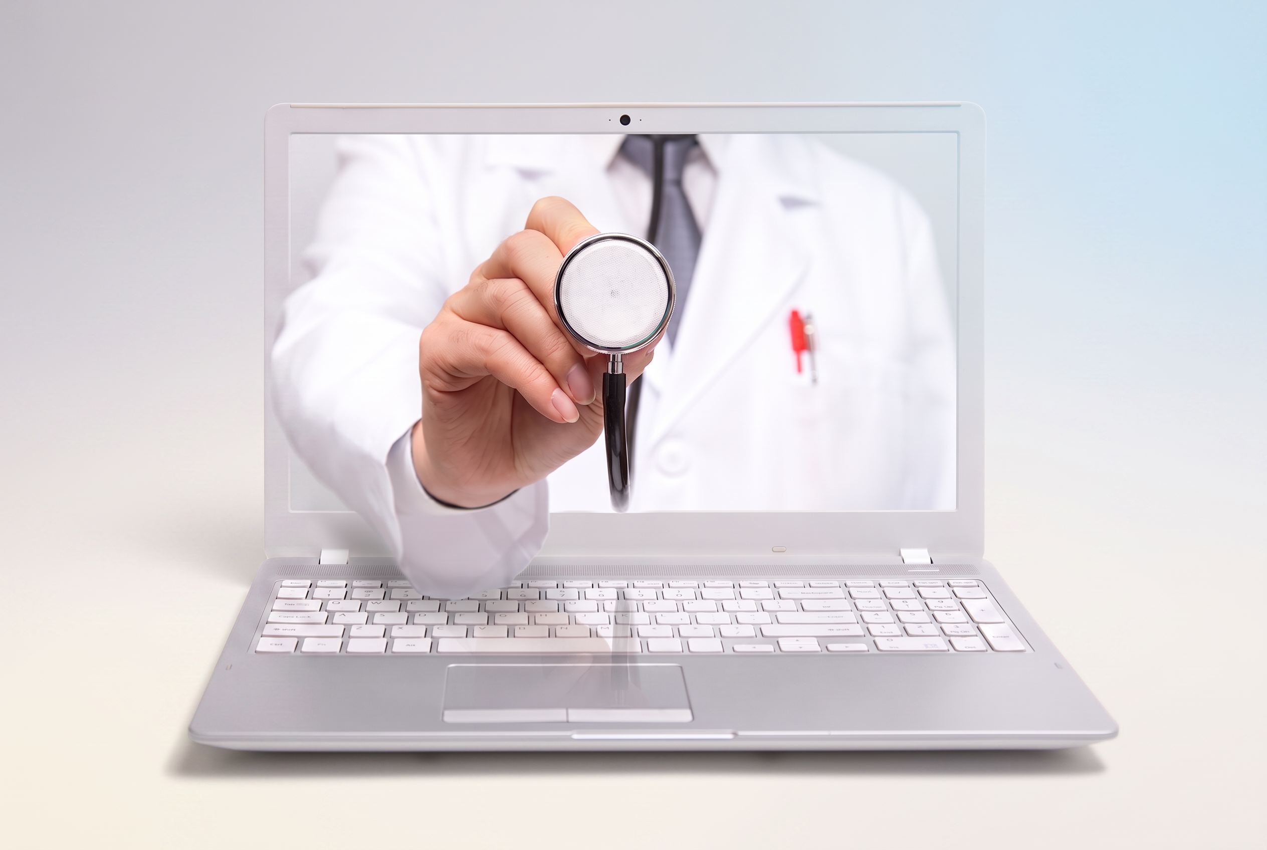 Telehealth doctor consulting through a laptop screen